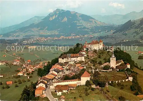 AK / Ansichtskarte Gruyeres_FR en direction de Broc Vue aerienne Gruyeres FR