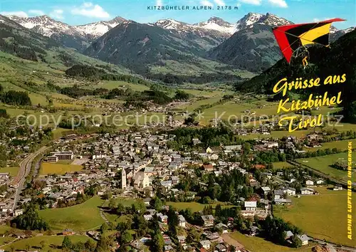 AK / Ansichtskarte Kitzbuehel_Tirol Fliegeraufnahme mit Pfarrkirche St Andreas und Kitzbueheler Alpen Kitzbuehel Tirol