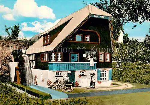 AK / Ansichtskarte Wuestenrot Wassergetriebenes Schwarzwaldhaus mit 16 sich bewegenden Figuren Wuestenrot