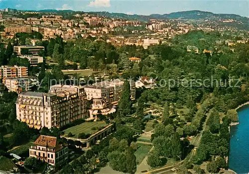 Lausanne_Ouchy Hotel de luxe au bord du lac Leman dans parc prive Piscine Tennis Vue aerienne Lausanne Ouchy