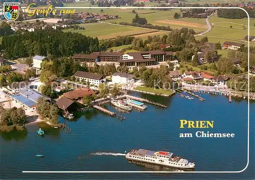 AK / Ansichtskarte Prien_Chiemsee Dampferhafen und Schiffsanlegestelle Fliegeraufnahme Prien Chiemsee