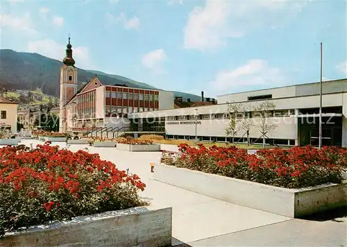 AK / Ansichtskarte Muerzzuschlag Volkshaus mit Kirche Muerzzuschlag
