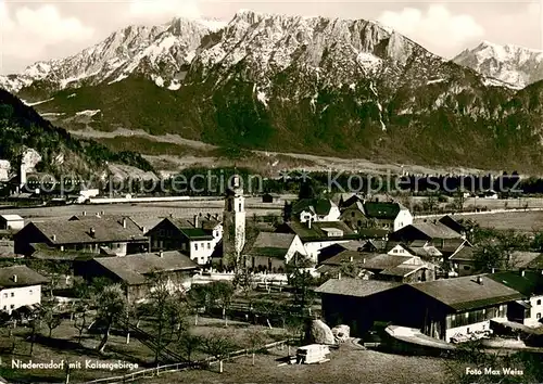 AK / Ansichtskarte Niederaudorf Ortsansicht mit Kirche Blick auf das Kaisergebirge Niederaudorf