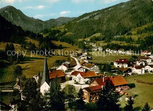 AK / Ansichtskarte Unterjoch Ortsansicht mit Kirche Blick zum Spiesser Allgaeuer Alpen Unterjoch