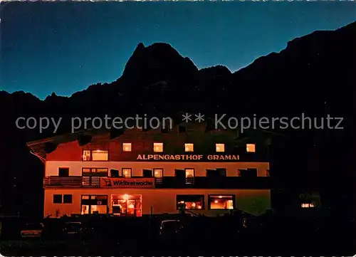 AK / Ansichtskarte Gramaialm Alpengasthof Gramai bei Nacht Gramaialm