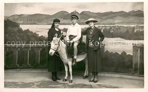 AK / Ansichtskarte Koenigswinter Damen mit Junge auf Esel Blick ueber den Rhein zum Siebengebirge Kuenstlerkarte Koenigswinter