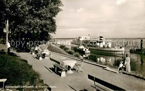 AK / Ansichtskarte Goetterswickerhamm_Niederrhein Uferpromenade am Rhein Bootsanleger Fahrgastschiff Goetterswickerhamm