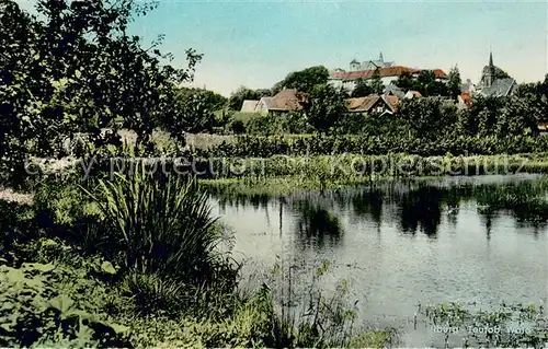 AK / Ansichtskarte Bad_Iburg Uferpartie am Wasser Blick zum Ort Bad_Iburg