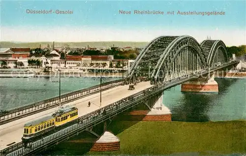 AK / Ansichtskarte Duesseldorf Rheinbruecke mit Ausstellungsgebaeude Strassenbahn Duesseldorf