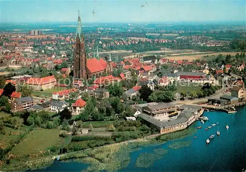 AK / Ansichtskarte Schleswig_Holstein Stadtbild mit St. Petri Kirche an der Schlei Schleswig_Holstein