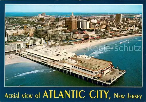 AK / Ansichtskarte Atlantic_City_New_Jersey Aerial view The bathing beach and Casino Hotels comprise the background 
