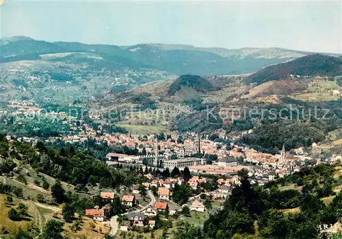 AK / Ansichtskarte Munster_68_Haut_Rhin_Elsass La ville au pied des Hautes Vosges Vue aerienne 
