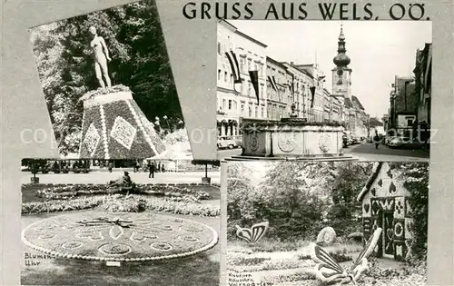 AK / Ansichtskarte Wels Ortszentrum Brunnen Knusperhaeuschen Volksgarten Blumenuhr Statue Wels