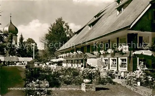 AK / Ansichtskarte Hinterzarten Adler Wirtshaus Terrasse Blick zur Kirche Kurort im Schwarzwald Hinterzarten
