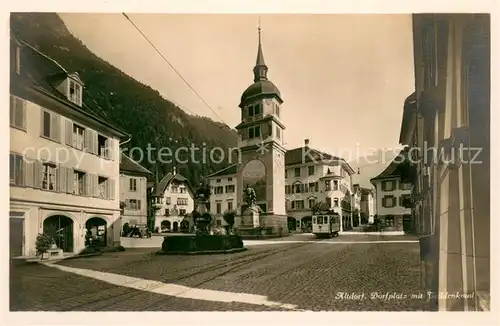 AK / Ansichtskarte Altdorf_UR Dorfplatz mit Telldenkmal Altdorf_UR