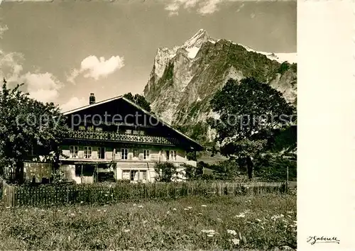 AK / Ansichtskarte Grindelwald Altes Bauernhaus mit Blick zum Wetterhorn Berner Alpen Grindelwald