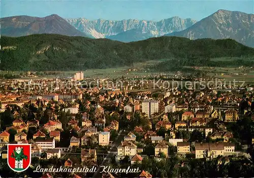 AK / Ansichtskarte Klagenfurt_Woerthersee Fliegeraufnahme Teilansicht m. Felsenkette der Karawanken Klagenfurt_Woerthersee