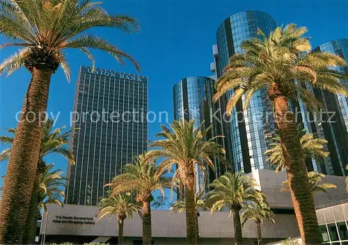AK / Ansichtskarte Los_Angeles_California Palm trees surrounding downtown Skyscrapers 