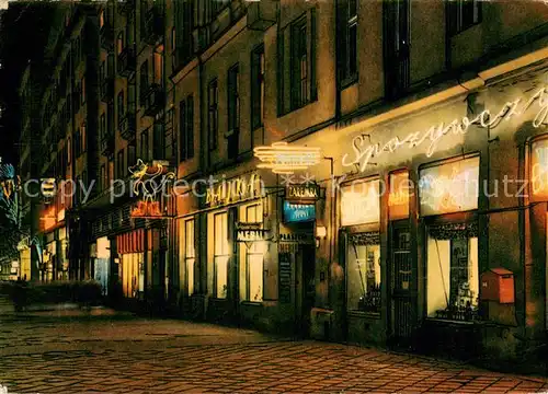 AK / Ansichtskarte Warszawa Aleje Jerozolimskie Partie Innenstadt Nachtaufnahme Warszawa