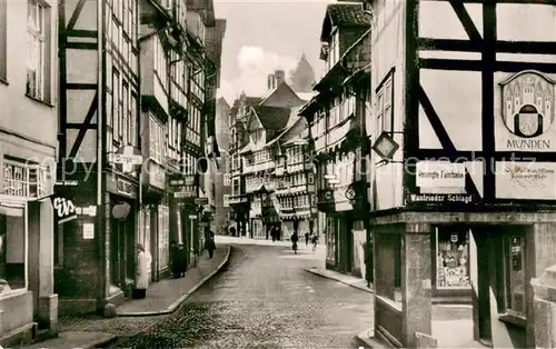 AK / Ansichtskarte Hann._Muenden Langestrasse Geschaefte Fachwerkhaeuser Hann. Muenden