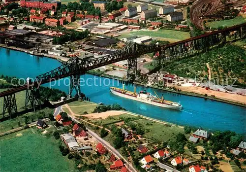 AK / Ansichtskarte Rendsburg Hochbruecke ueber den Nord Ostsee Kanal mit Schwebefaehre Fliegeraufnahme Rendsburg
