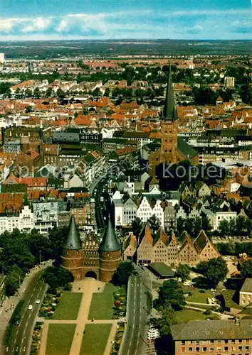 AK / Ansichtskarte Luebeck Holsten Tor Kirche Fliegeraufnahme Luebeck