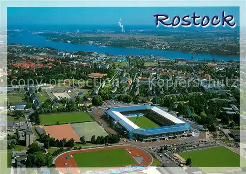 AK / Ansichtskarte Rostock Fliegeraufnahme mit Fussballstadion 