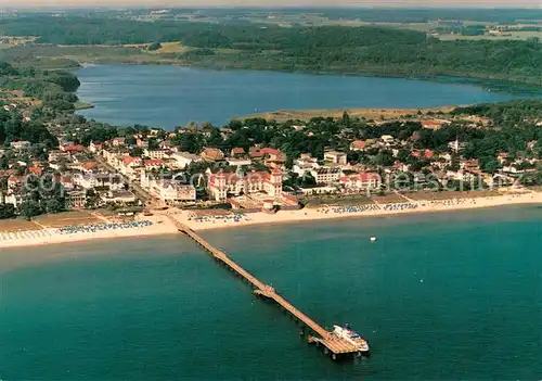 AK / Ansichtskarte Ruegen Fliegeraufnahme Seebad Binz Seebruecke Kurhaus Schmachter See Ruegen