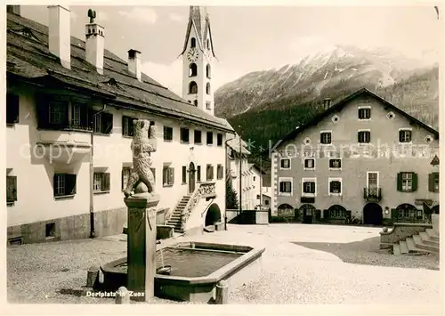 AK / Ansichtskarte Zuoz_GR Dorfplatz mit Brunnen und Kirche Zuoz_GR