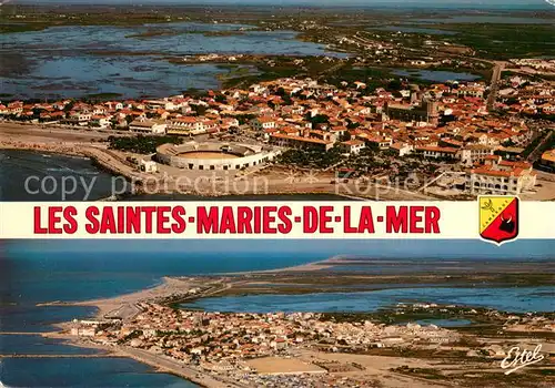 AK / Ansichtskarte Les_Saintes Maries de la Mer Les arenes eglise et au fond les marais vue aerienne Les