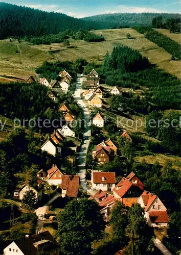AK / Ansichtskarte Wildemann Blick zur Seesenerstrasse Fliegeraufnahme Wildemann