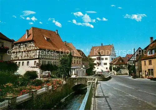 AK / Ansichtskarte Dettelbach Partie in der Innenstadt Bruecke Bachlauf Fachwerkhaus Dettelbach