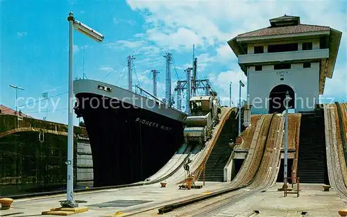 AK / Ansichtskarte Panama Gatun Locks Panama Canal Vessel in transit passing through open gates from one lock chamber to another At right stands the control tower Panama