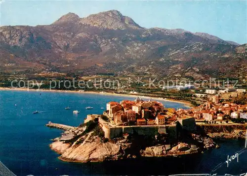 AK / Ansichtskarte Calvi La citadelle et l immense plage bordee de pins vue aerienne Calvi