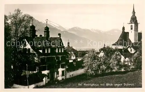 AK / Ansichtskarte Schwyz_SZ Ital Redinghaus mit Kirche 