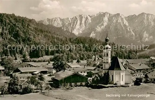 AK / Ansichtskarte Sachrang_Chiemgau Panorama mit Kirche und Kaisergebirge Sachrang Chiemgau