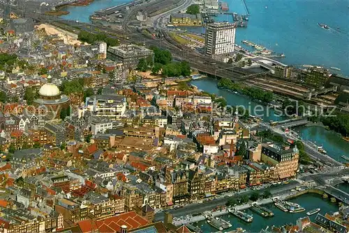 AK / Ansichtskarte Amsterdam__NL Fliegeraufnahme Damrak Lutherse Kerk en Havengebouw 