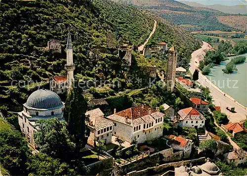 AK / Ansichtskarte Pocitelj_Bosnia The centre of settlement with the mosque medresa the clock tower and the hostels of Pociteljs captains Air view 