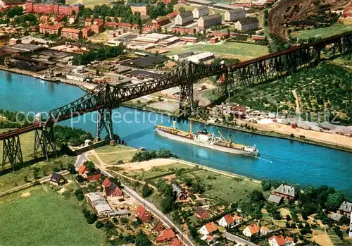 AK / Ansichtskarte Rendsburg Hochbruecke ueber den Nord Ostsee Kanal mit Schwebefaehre Fliegeraufnahme Rendsburg