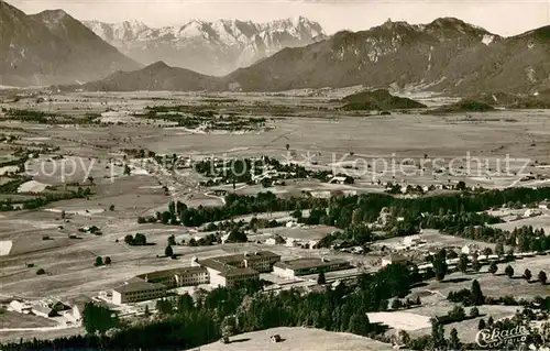 AK / Ansichtskarte Murnau_Staffelsee Hermann Schramm Haus mit Zugspitze Fliegeraufnahme Murnau_Staffelsee