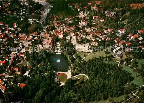 AK / Ansichtskarte Braunlage Kurviertel und Kunssteisstadion Fliegeraufnahme Braunlage