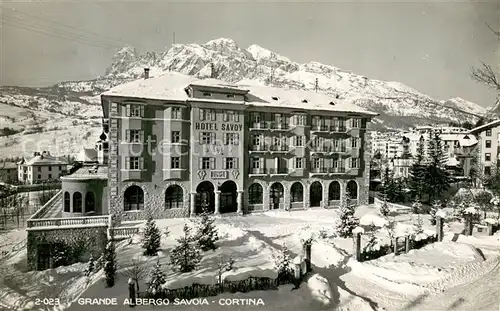 AK / Ansichtskarte Cortina_d_Ampezzo Grande Albergo Savoia Hotel Aussenansicht Winter Schnee Cortina_d_Ampezzo