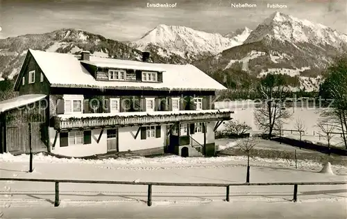 AK / Ansichtskarte Langenwang_Fischen Pension Torfisch Aussenansicht Winter Schnee m. Entschenkopf Nebelhorn Rubihorn Langenwang Fischen