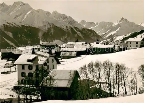 AK / Ansichtskarte Villa_GR Dorfansicht mit Piz Ault und Piz Terri Winterlandschaft Alpen Villa_GR