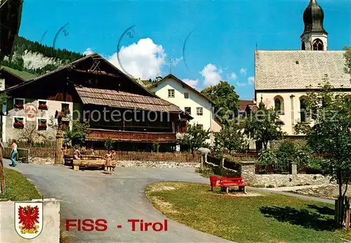 AK / Ansichtskarte Fiss_Tirol_AT PArtie am Brunnen m. Kirche 