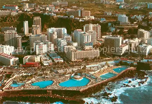 AK / Ansichtskarte Puerto de la Cruz_Tenerife_ES Fliegeraufnahme Schwimmbaeder u. Hotels 