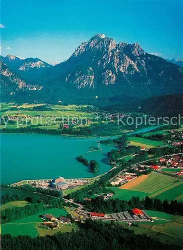 AK / Ansichtskarte Forggensee_Schwangau mit den Koenigsschloessern und dem Musical Theater Neuschwanstein Fliegeraufnahme Forggensee Schwangau