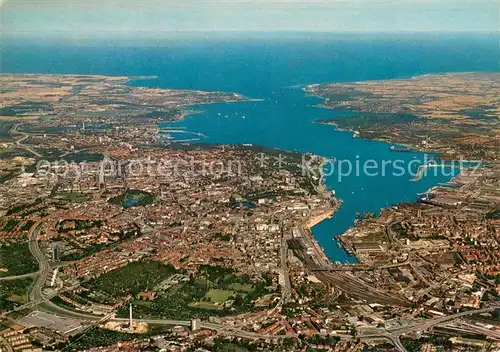AK / Ansichtskarte Kiel Stadt und Foerde mit Blick auf die Ostsee Fliegeraufnahme Kiel