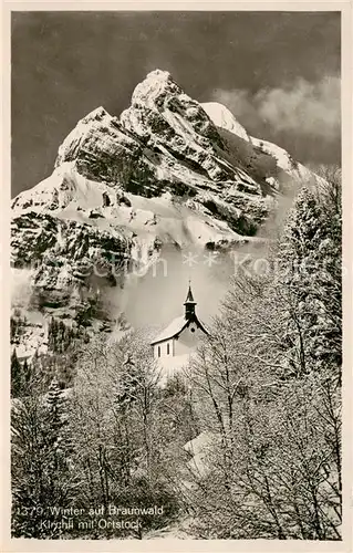 AK / Ansichtskarte Braunwald_GL Kirche m. Ortstock Winter Braunwald GL