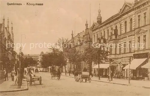 AK / Ansichtskarte Gumbinnen_Goesev_Gussew_Oblast_Kaliningrad_RU Koenigsstrasse m. Kutschen Feldpost 